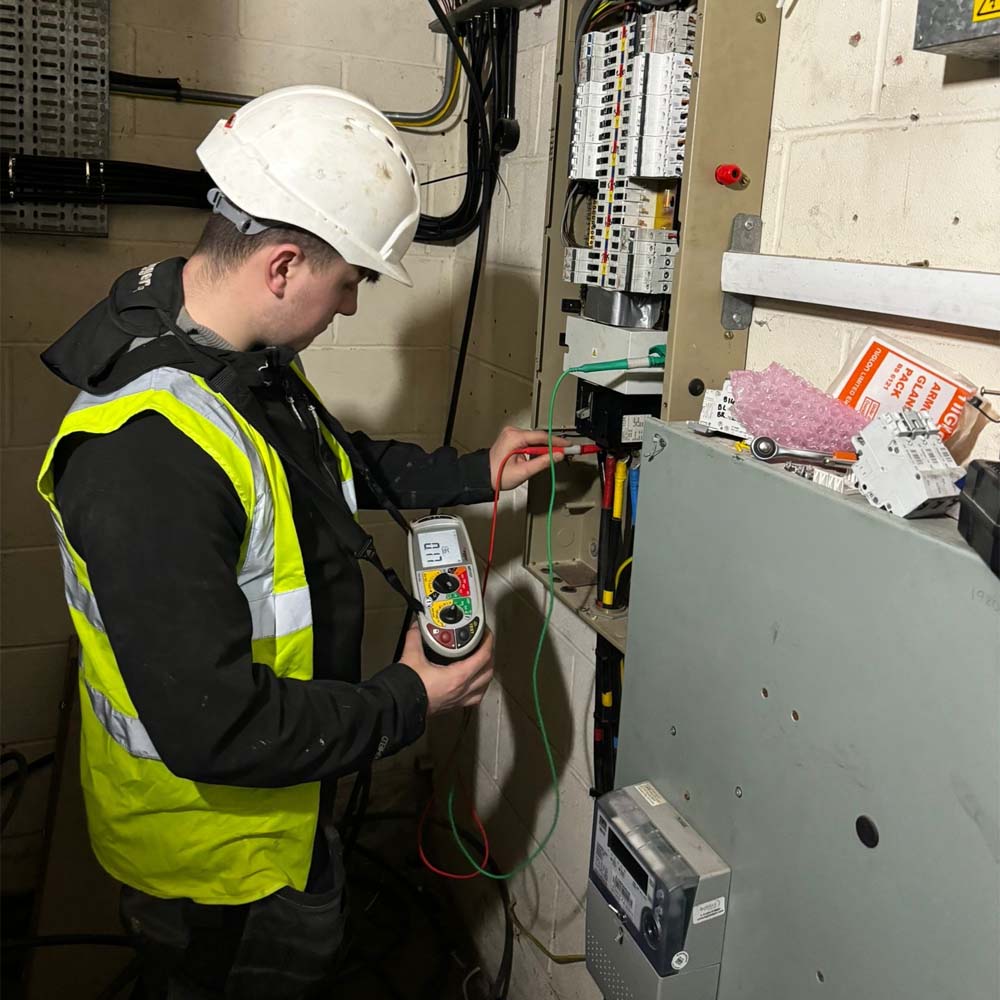 APP Electrical team member conducting EICR testing for a commercial business.
